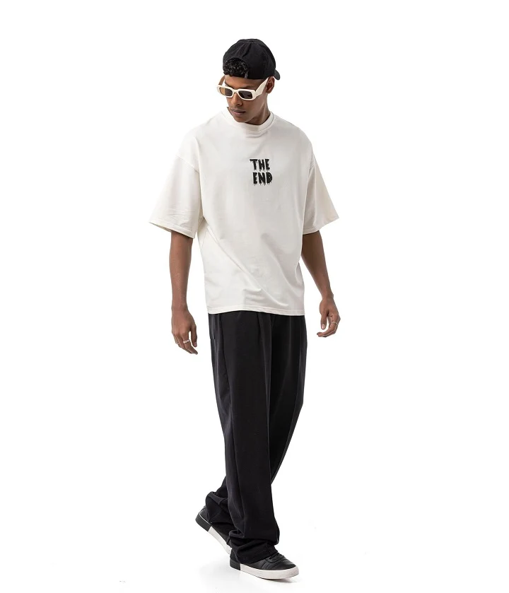 21 Men's T-Shirt Outfit Ideas That Actually Look Put Together 6 Cream Boxy Tee Over Wide Black Trousers