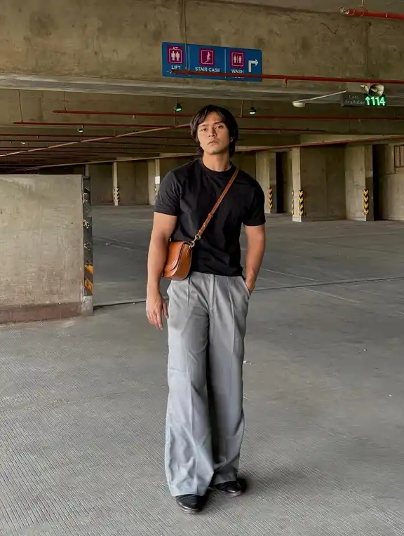 Summer Fashion for Skinny Guys: 20 Looks That Add Shape and Height 16 Black Tee and Gray Wide Trousers