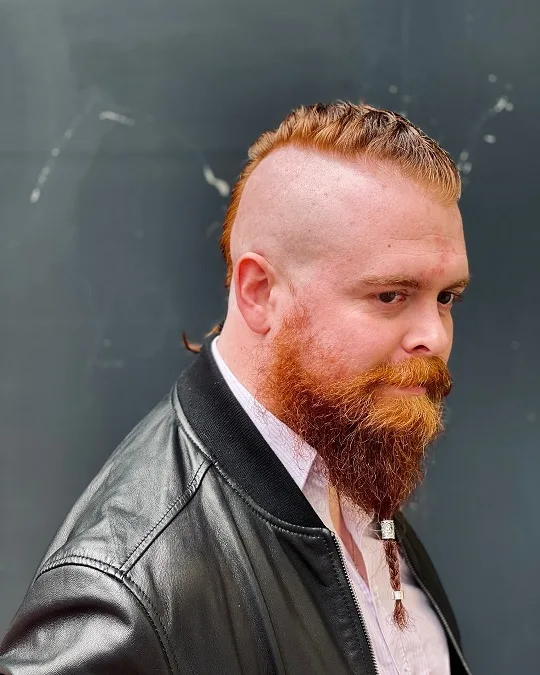 22 Warrior Haircut Ideas for Men: Braids, Fades, and Full Beards 12 Shaved Sides With a Braided Beard
