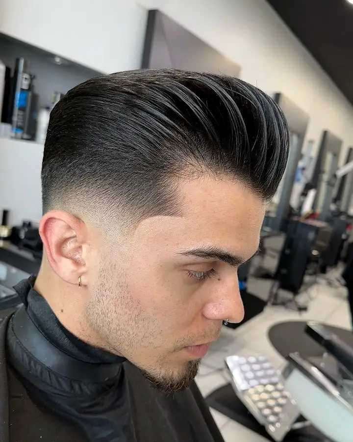 20 Pompadour Hairstyles for Men, From Skin Fades to Soft Tapers 5 High Shine Pompadour With a Sharp Line Up