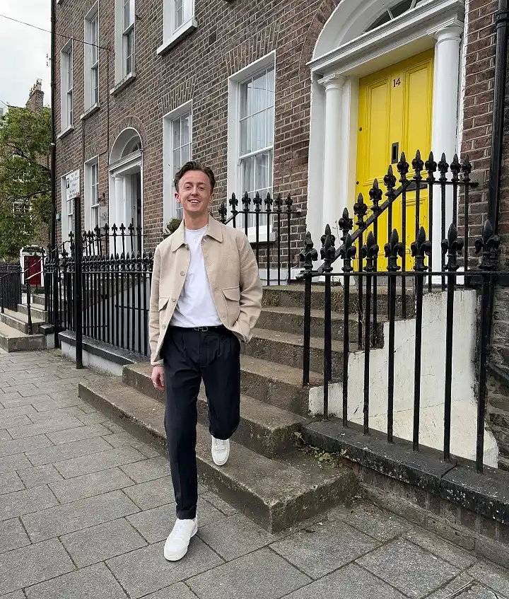 Clean White Sneakers With a Beige Overshirt and Black Trousers