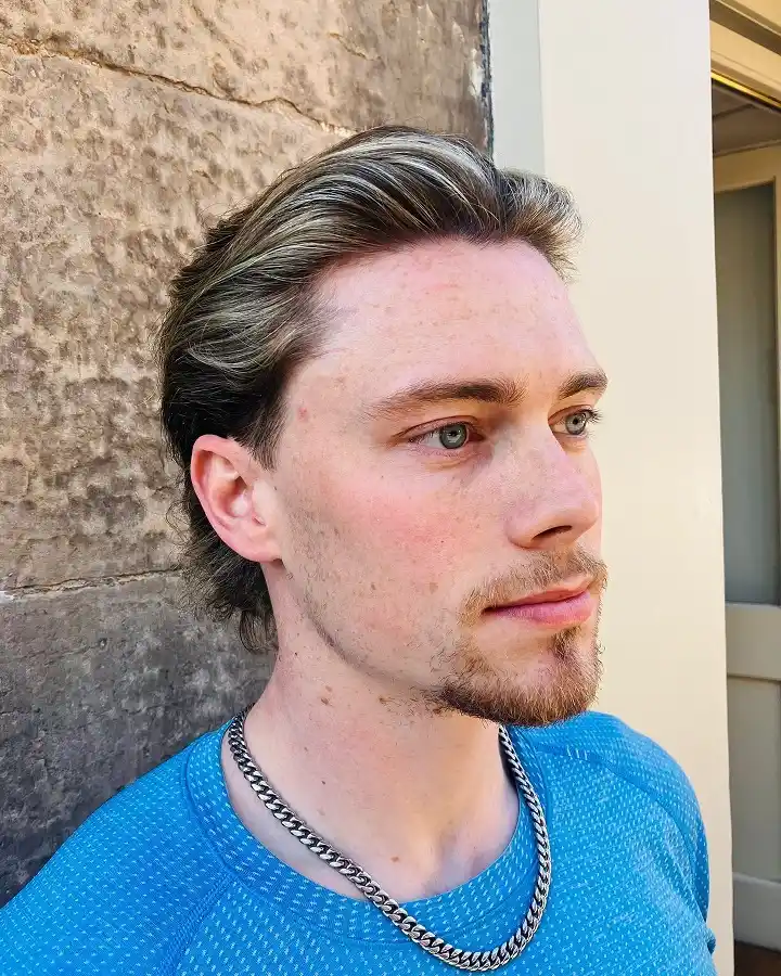15 Cool Blonde Hair Ideas for Men That Look Fresh, Not Bleached 10 Grown Out Sandy Blonde Slicked Straight Back