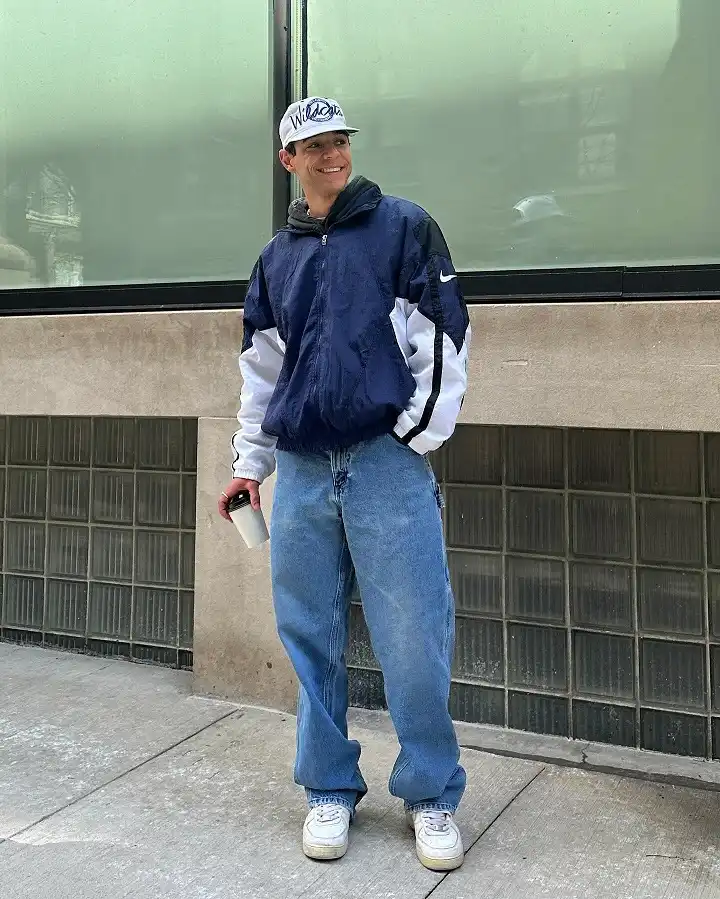A Color Blocked Windbreaker Over Baggy Light Wash Jeans