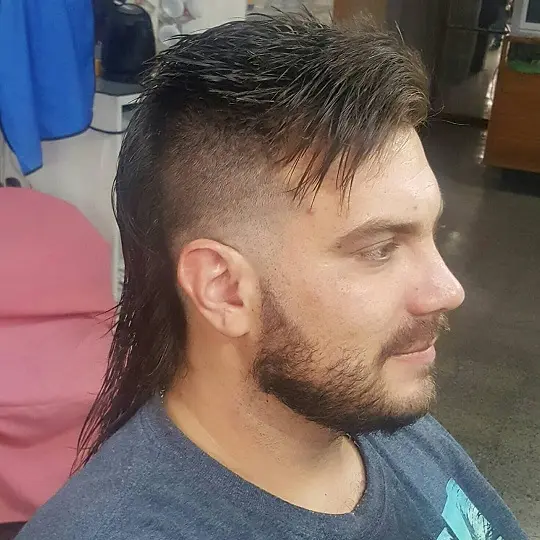 22 Warrior Haircut Ideas for Men: Braids, Fades, and Full Beards 13 Wet Look Mullet With a High Skin Fade