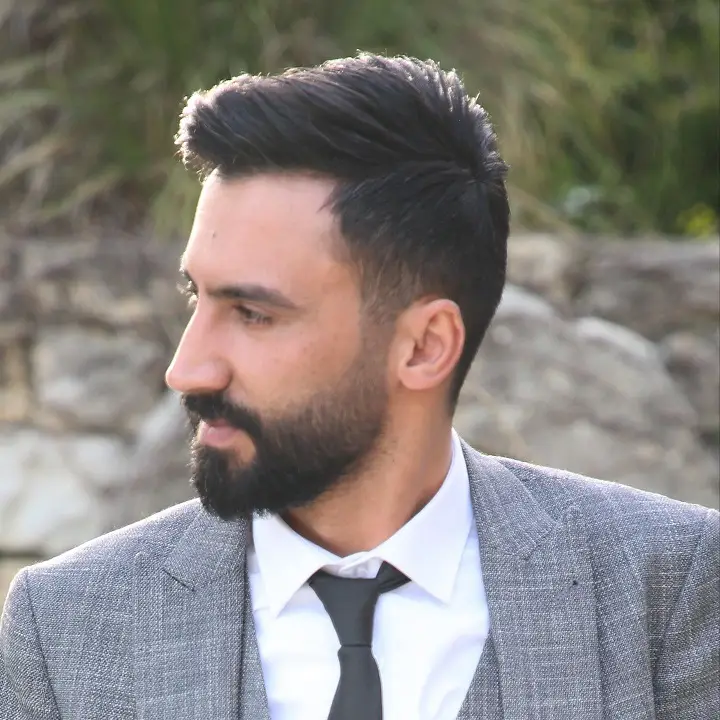 23 Sharp Gentleman Haircuts That Never Go Out of Style 9 Sculpted Quiff Paired With a Full Beard