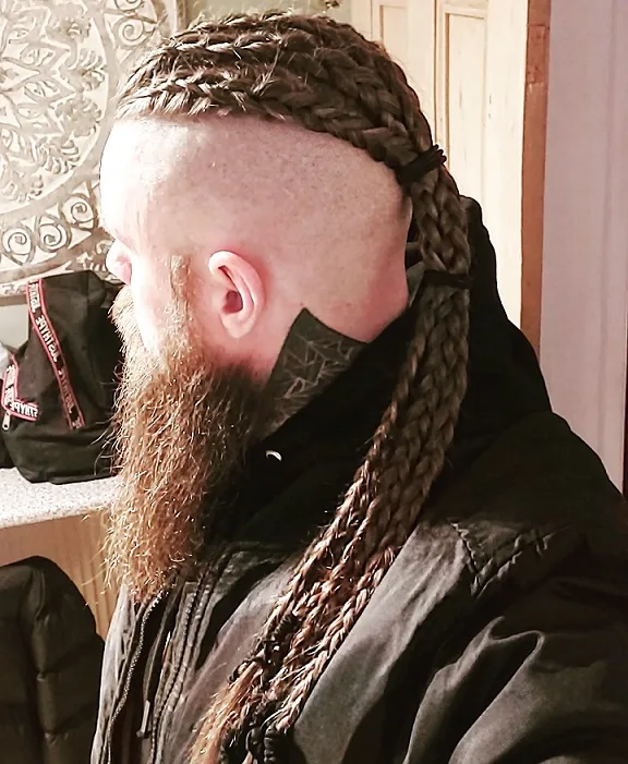 22 Warrior Haircut Ideas for Men: Braids, Fades, and Full Beards 5 Viking Braids Over Shaved Sides
