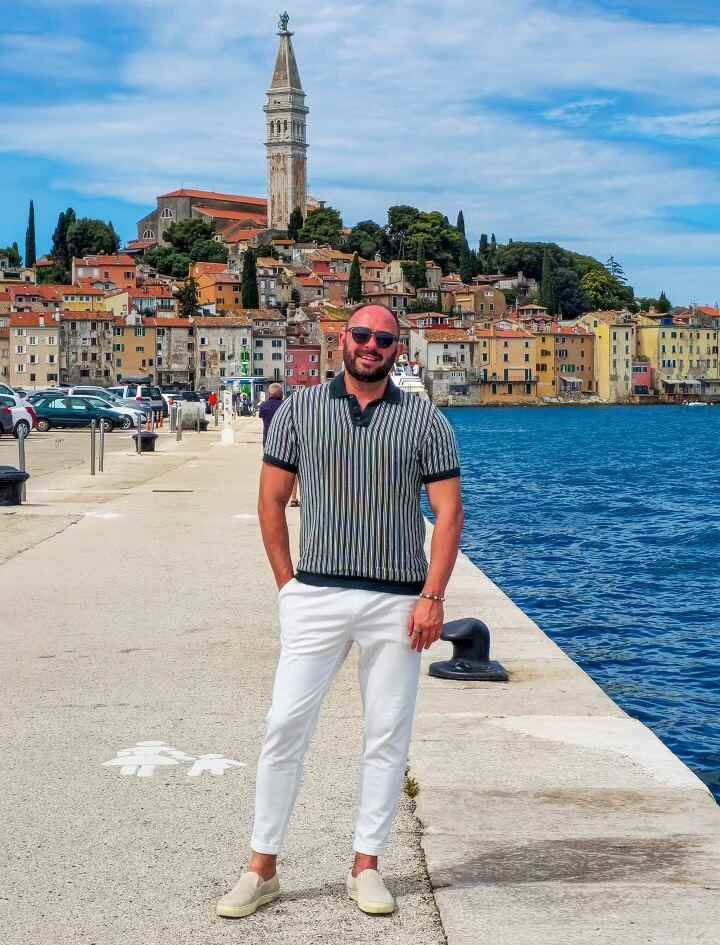 A Striped Knit Polo and Cuffed White Trousers for Waterfront Ease