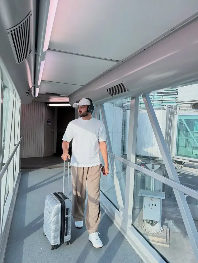 18 Airport Outfit Men Summer Ideas That Stay Cool All Flight 9 White Boxy Tee and Wide-Leg Beige Trousers for Long Hauls