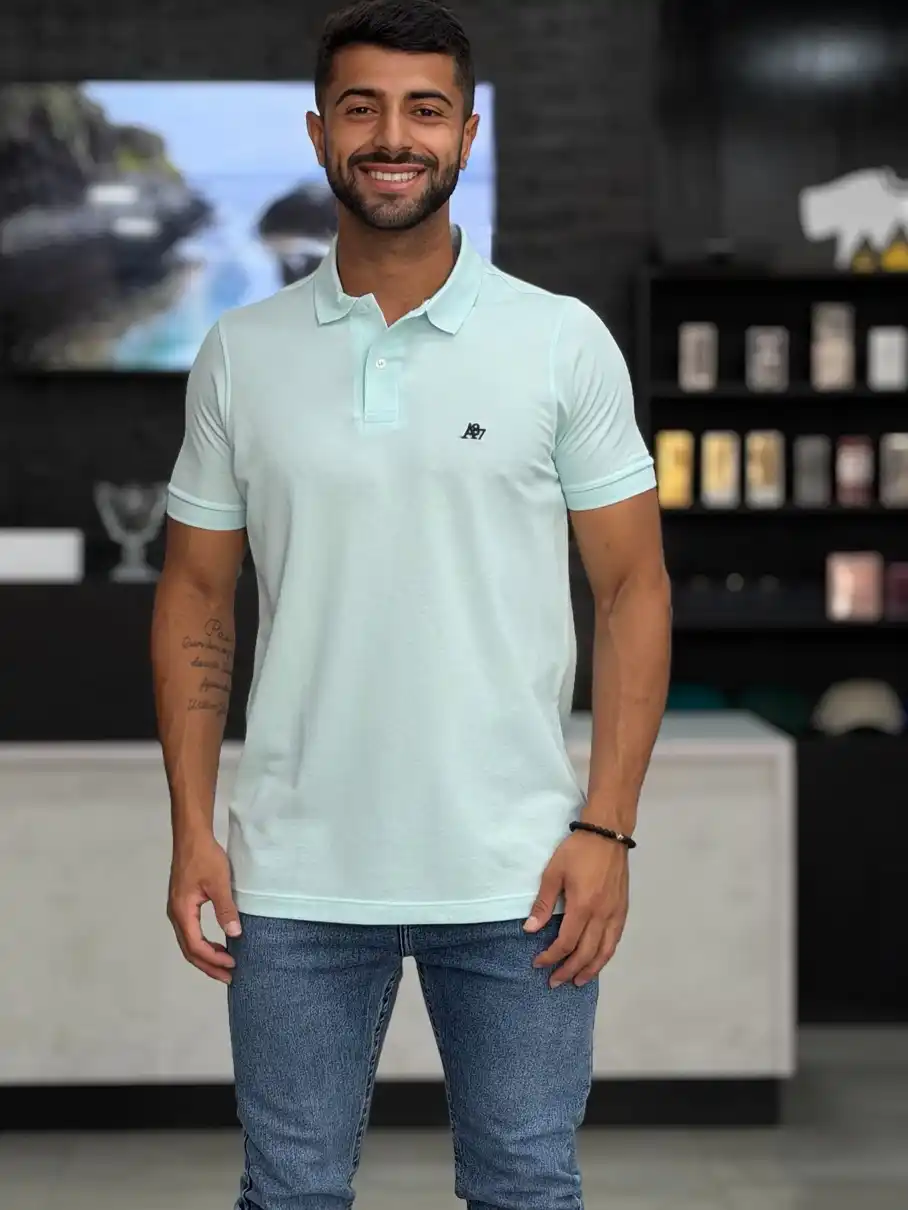 29 Summer Capsule Wardrobe Essentials for Men's Carry-Ons 4 A Soft Mint Polo for the In Between Days