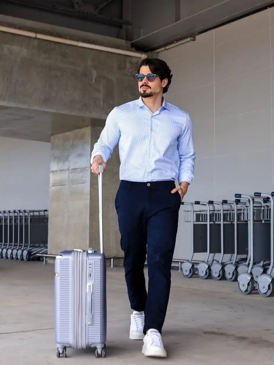 18 Travel Capsule Wardrobe Ideas for Men: Fly Light, Look Sharp 16 A Dress Shirt and White Sneakers Is the Business Trip Uniform Worth Copying