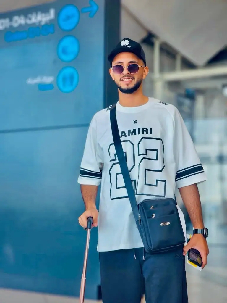 18 Airport Outfit Men Summer Ideas That Stay Cool All Flight 14 Oversized Jersey Tee and Wide Black Trousers
