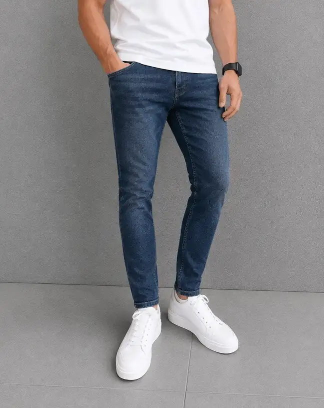 27 Minimalist Jeans and Pants for Men That Work in Every Season 11 Dark Tapered Jeans Built Around White Sneakers