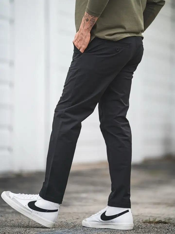 27 Minimalist Jeans and Pants for Men That Work in Every Season 14 Black Tapered Chinos, the Quiet Workhorse