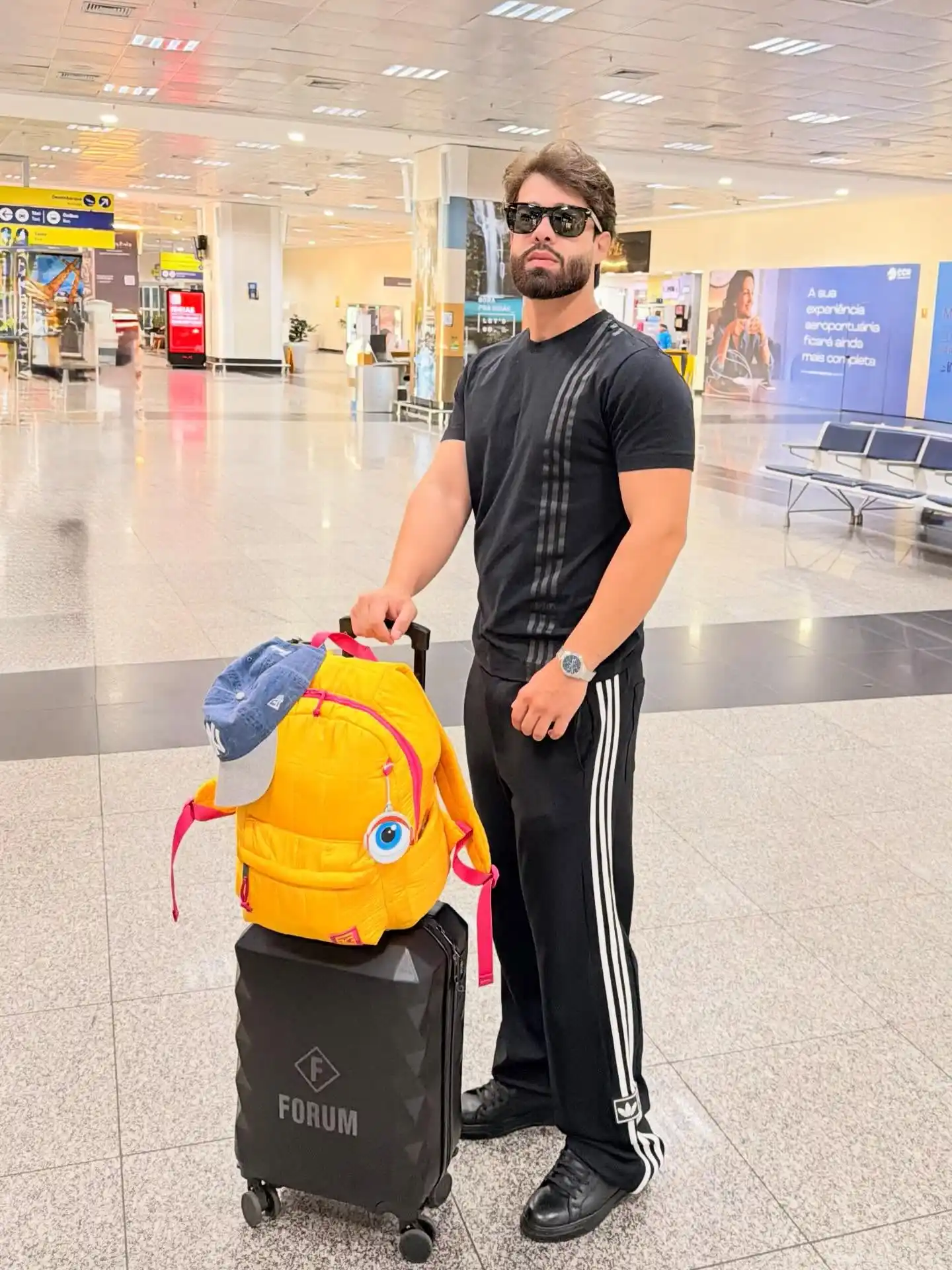 Looking Good at the Gate: 10 Summer Vacation Airport Outfit Ideas for Men 5 4. The Classic Athletic Tracksuit