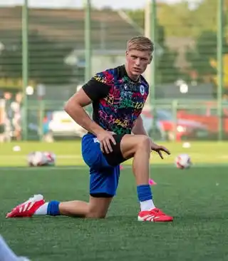7. Vibrant Abstract Print Jersey with Royal Blue Shorts