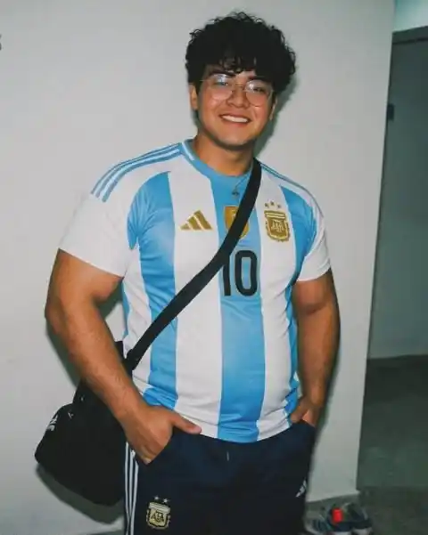 3. Light Blue Vertical Striped Jersey with Black Sling Bag