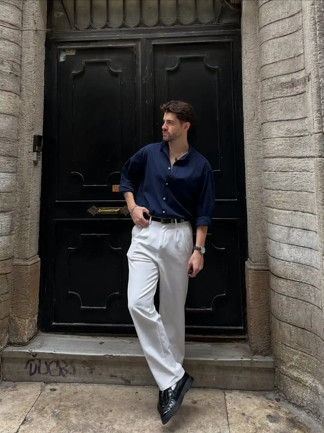 13 Classy Summer Outfit Ideas for Men That Beat the Heat in Style 9 7. Deep Navy Button Down and Pleated White Trousers