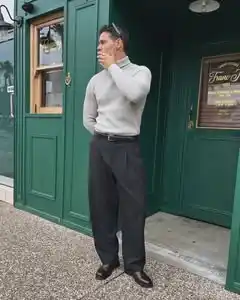 15. The Ribbed Turtleneck and Pleated Trousers