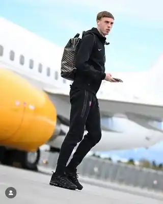 14 Airport Outfit Men With Sneakers Combos to Steal 14 13. Athletic Zip Up and Tapered Track Pants