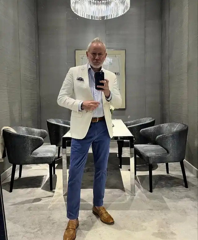 2. The Cream Blazer and Blue Trousers