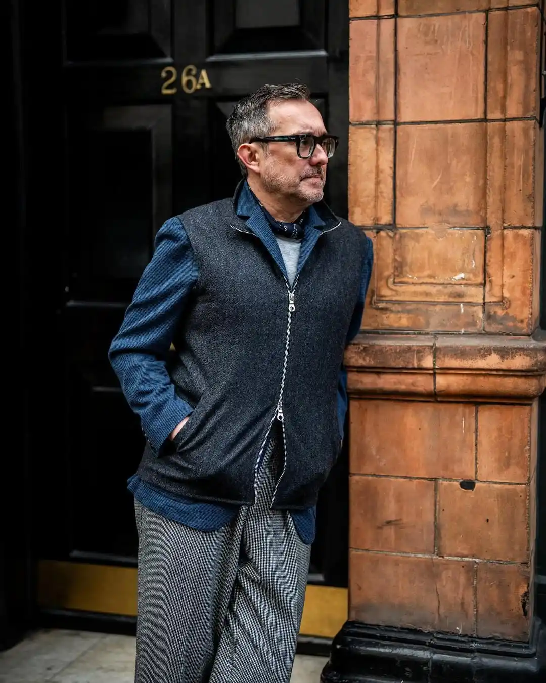 5. The Layered Vest and Patterned Trousers