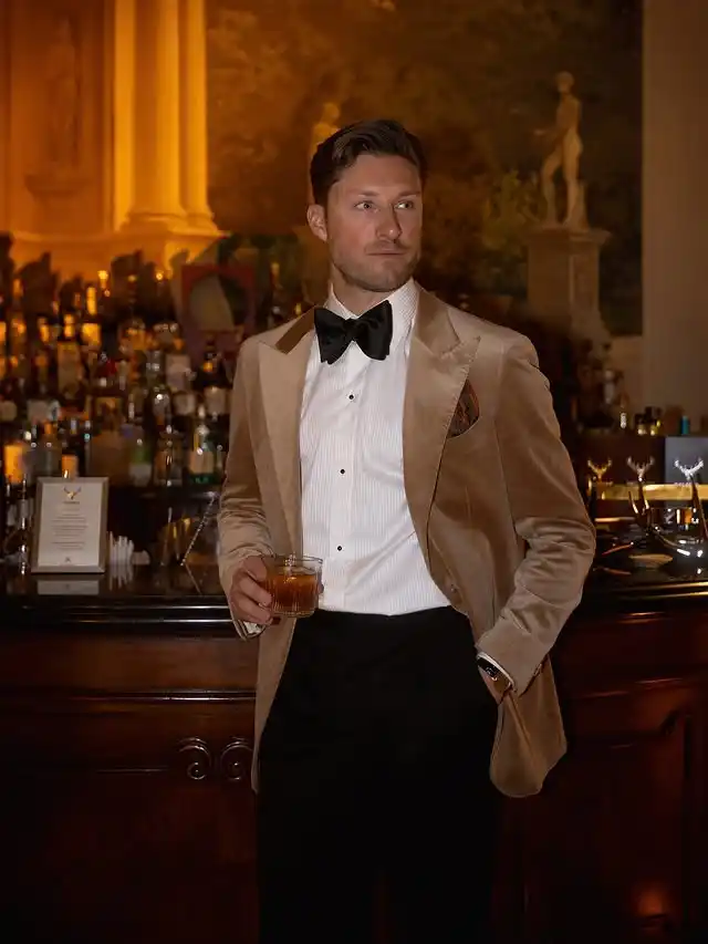 13 Classy Outfits Men Holiday Party Looks for Festive Season 12 11. Velvet Dinner Jacket with Black Bow Tie