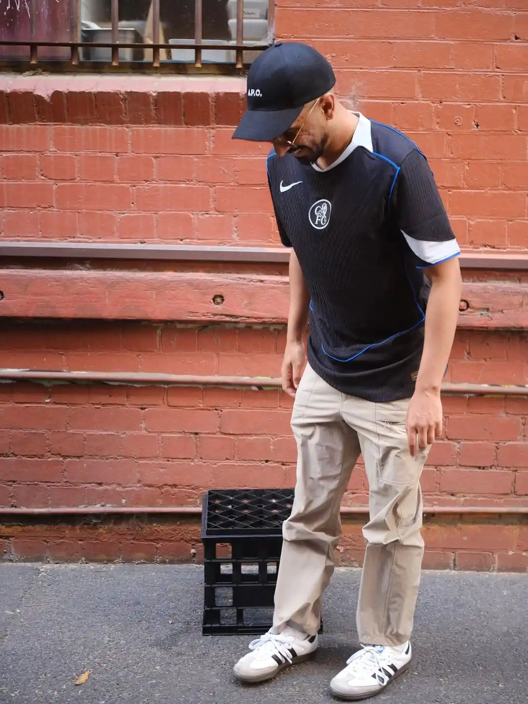2. Sleek Black Jersey with Neutral Cargo Pants