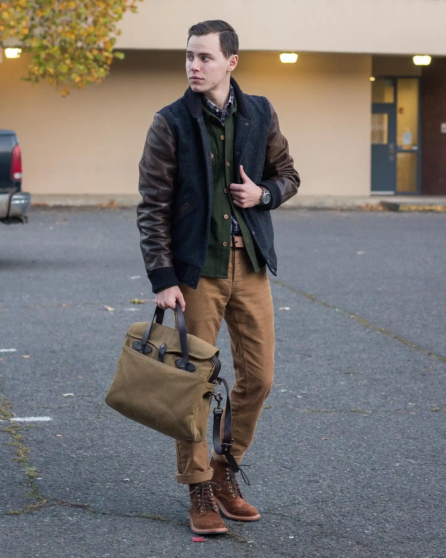 15 Classy Winter Outfit Combos for Men 13 11. Varsity Jacket and Flannel Overshirt