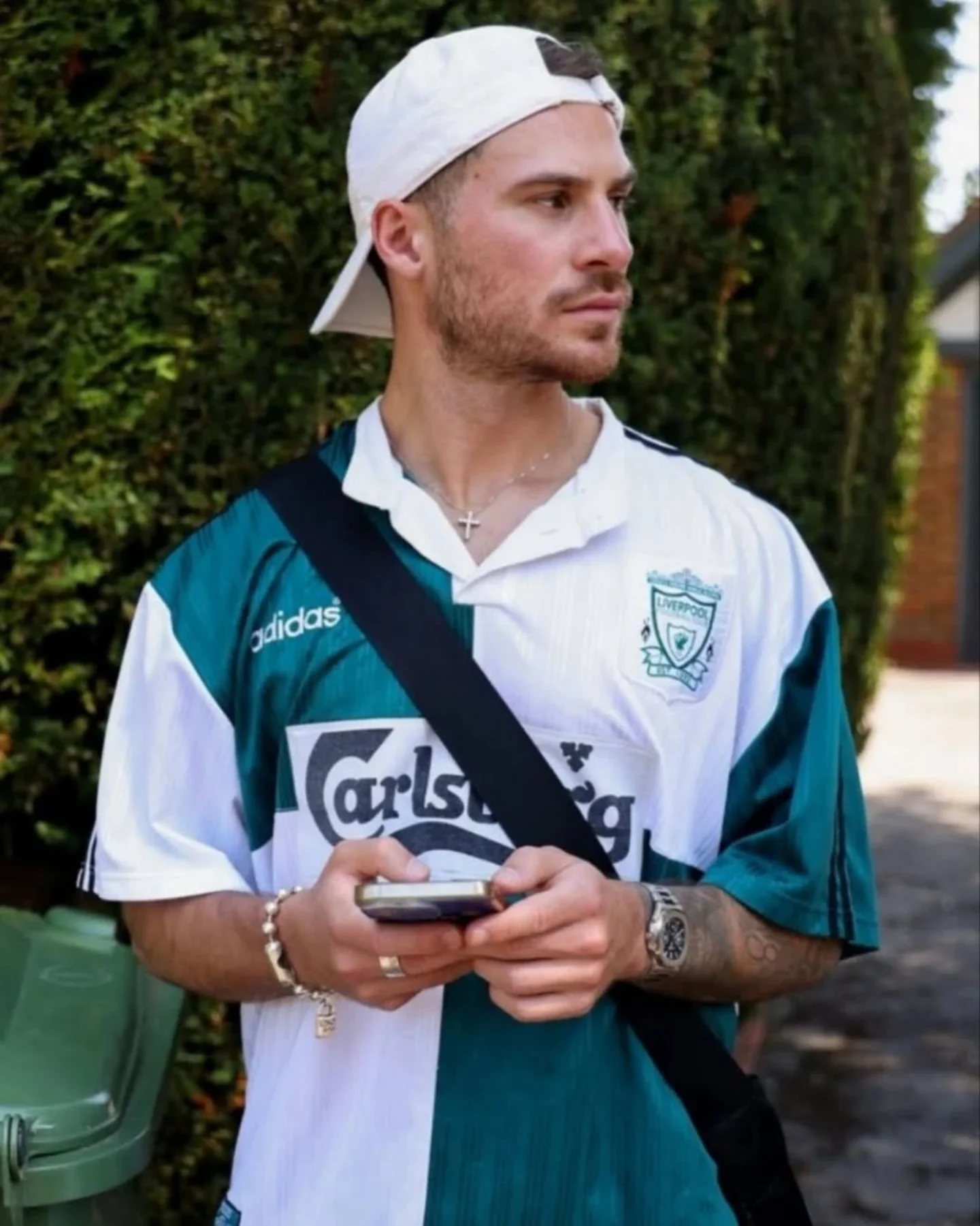 6. Vintage Liverpool Away Jersey With a Crossbody Bag and Stacked Jewelry