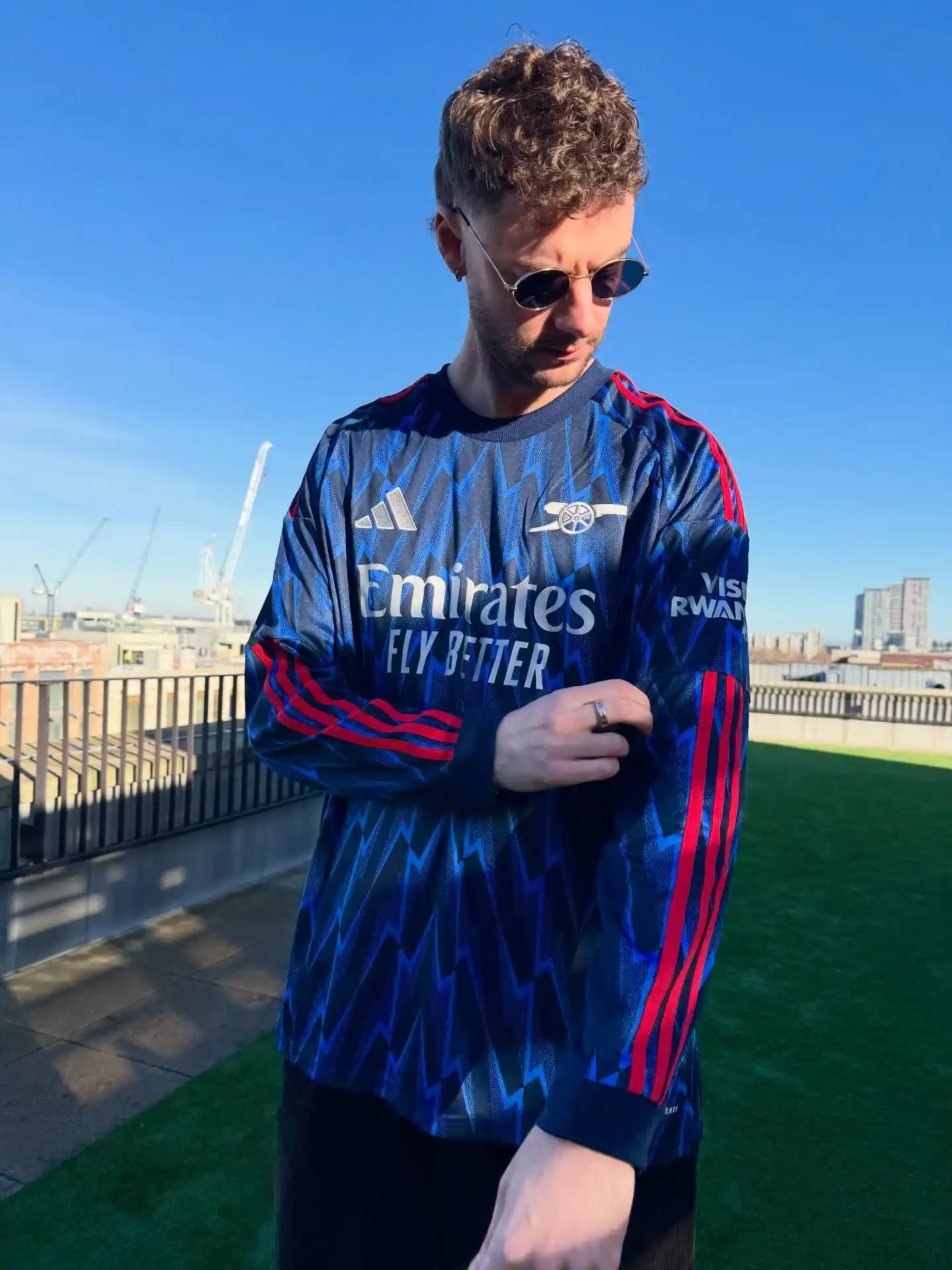 1. Long Sleeve Soccer Jersey With Dark Trousers and Aviator Sunglasses