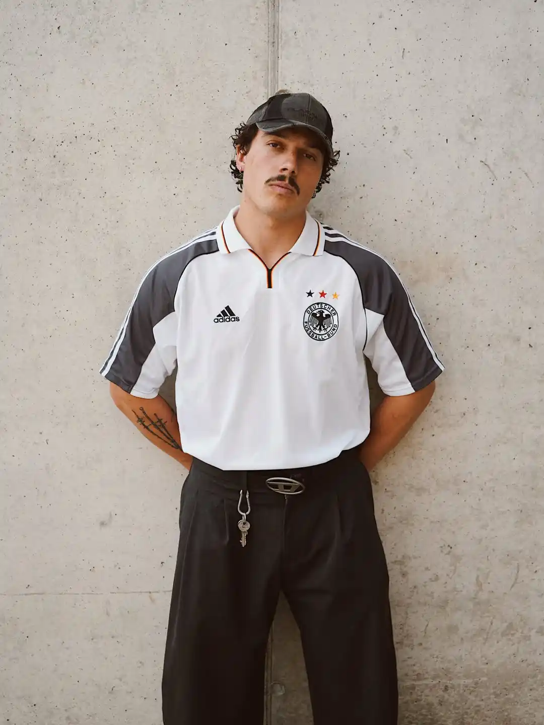 13 Soccer Jersey Outfit Men Luxury Looks Worth Every Penny 7 6. Germany Retro Adidas Jersey Styled With Diesel Belt and Baggy Trousers