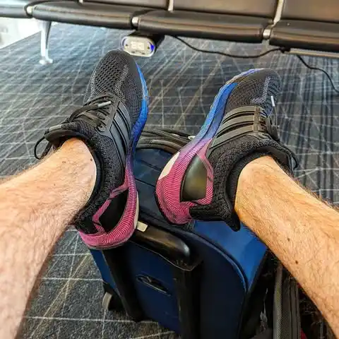 14 Airport Outfit Men With Sneakers Combos to Steal 6 5. Knit Sport Shoes and Shorts Combo