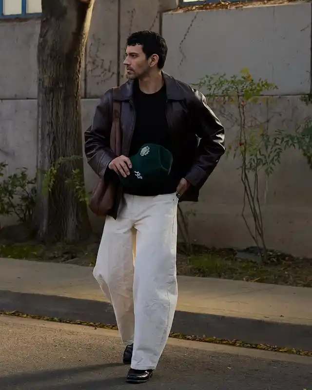 15 Classy Streetwear Outfit Ideas for Men That Elevate the Game 5 3. Brown Leather Jacket and Wide Off White Trousers