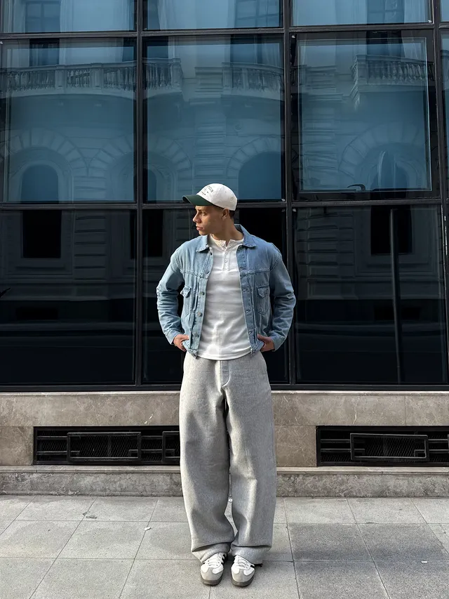 15 Classy Streetwear Outfit Ideas for Men That Elevate the Game 17 15. Light Wash Denim Jacket and Wide Grey Sweatpants