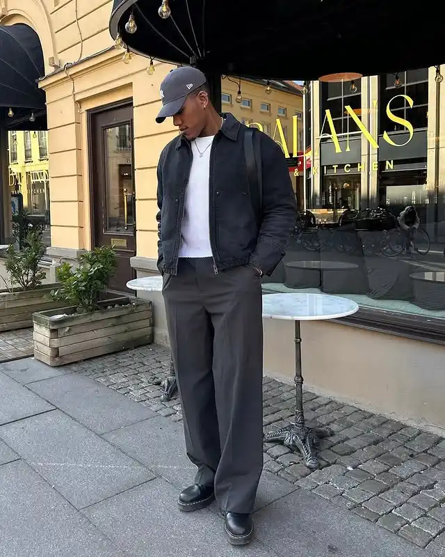13 Minimalist Men’s Travel Capsule Outfits (Carry‑On Only) 4 3. Dark Cropped Jacket