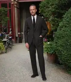 14. The Monochromatic Black Suit and White Contrast