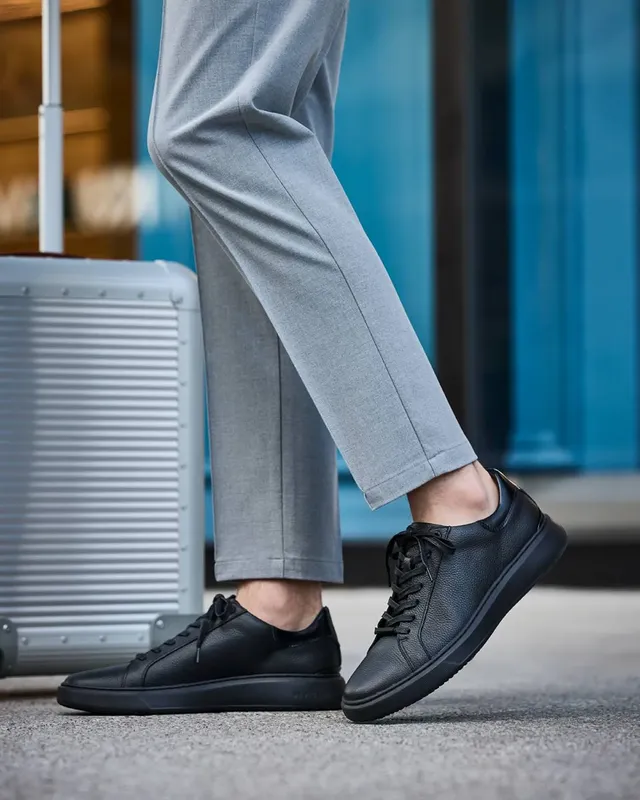 15 Shoe Styles That Complement Tall Men (Balance Height) 13 12. Monochromatic Minimalist Sneakers