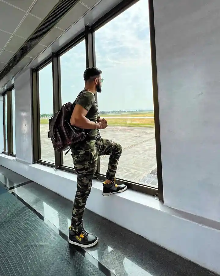 Looking Good at the Gate: 10 Summer Vacation Airport Outfit Ideas for Men 9 7. The Rugged Camouflage Set
