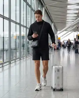 15 Airport Outfit Men Plus Size Ideas That Actually Fit Right 3 2. All Black Hoodie and Shorts Combo