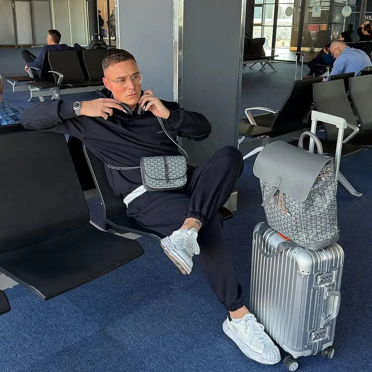 15 Airport Outfit Men Plus Size Ideas That Actually Fit Right 12 11. Dark Crewneck and Cuffed Joggers with Premium Accessories