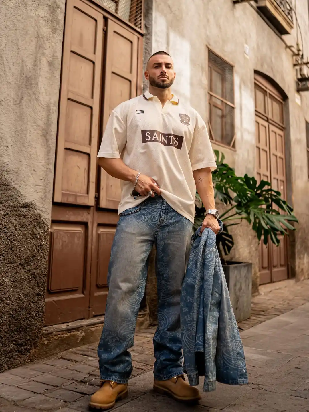 11 Soccer Jersey Outfit Men Holiday Travel Combos That Work 5 4. Cream Saints Polo Jersey with Paisley Denim