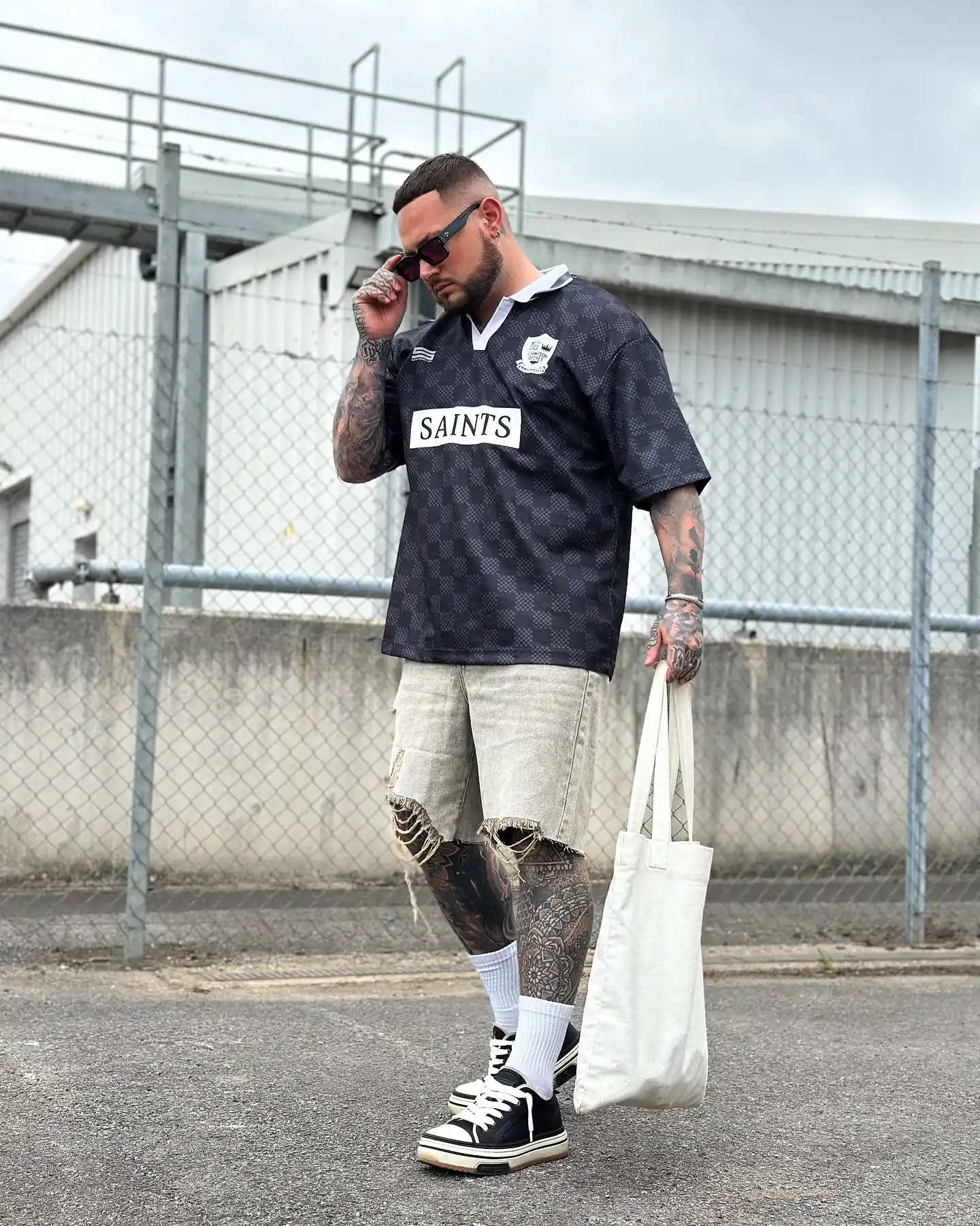 9. Black Checkered Jersey With Distressed Denim Shorts and Canvas Low Tops