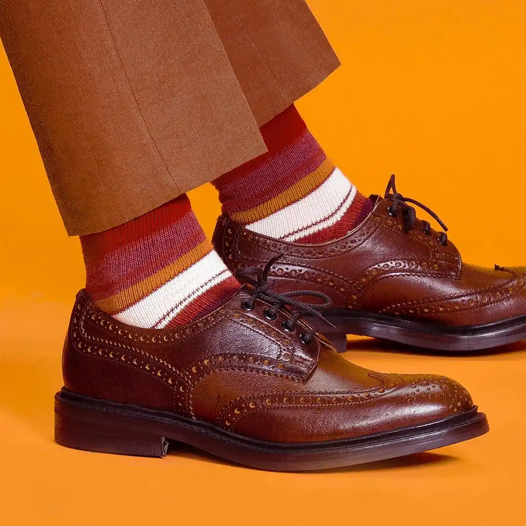 15 Shoe Styles That Complement Tall Men (Balance Height) 10 9. Textured Wingtip Derbies