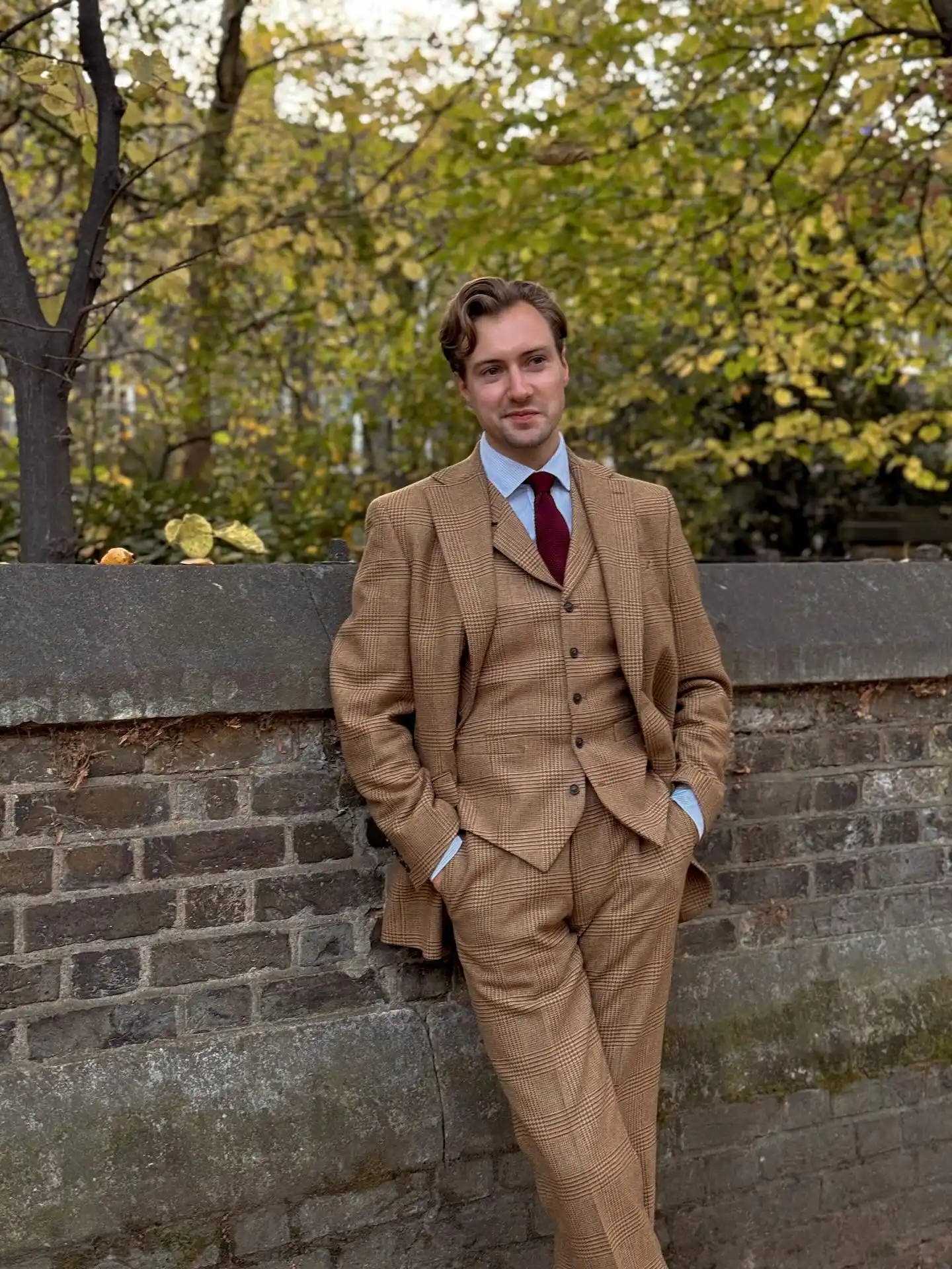 15 Classy Winter Outfit Combos for Men 7 5. Three-Piece Plaid Wool Suit and Knit Tie