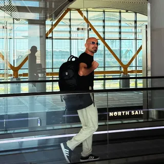 11 Airport Outfit Men Tall Guys Swear By 8 7. The Fitted Tee and Light Trousers Walk