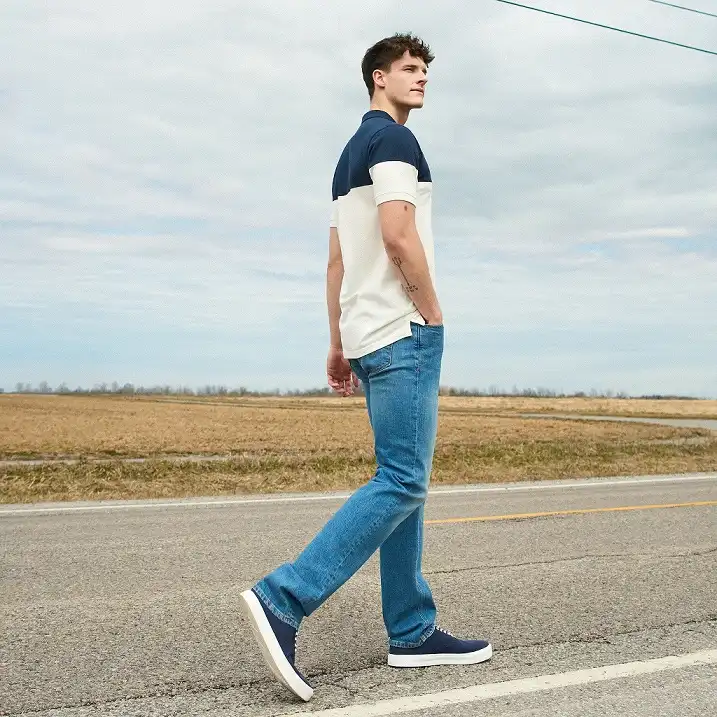20 Classy Outfit Ideas for Tall Men That Actually Work 2 Color Blocked Polo and Straight Leg Denim, Built for the Long Torso Problem