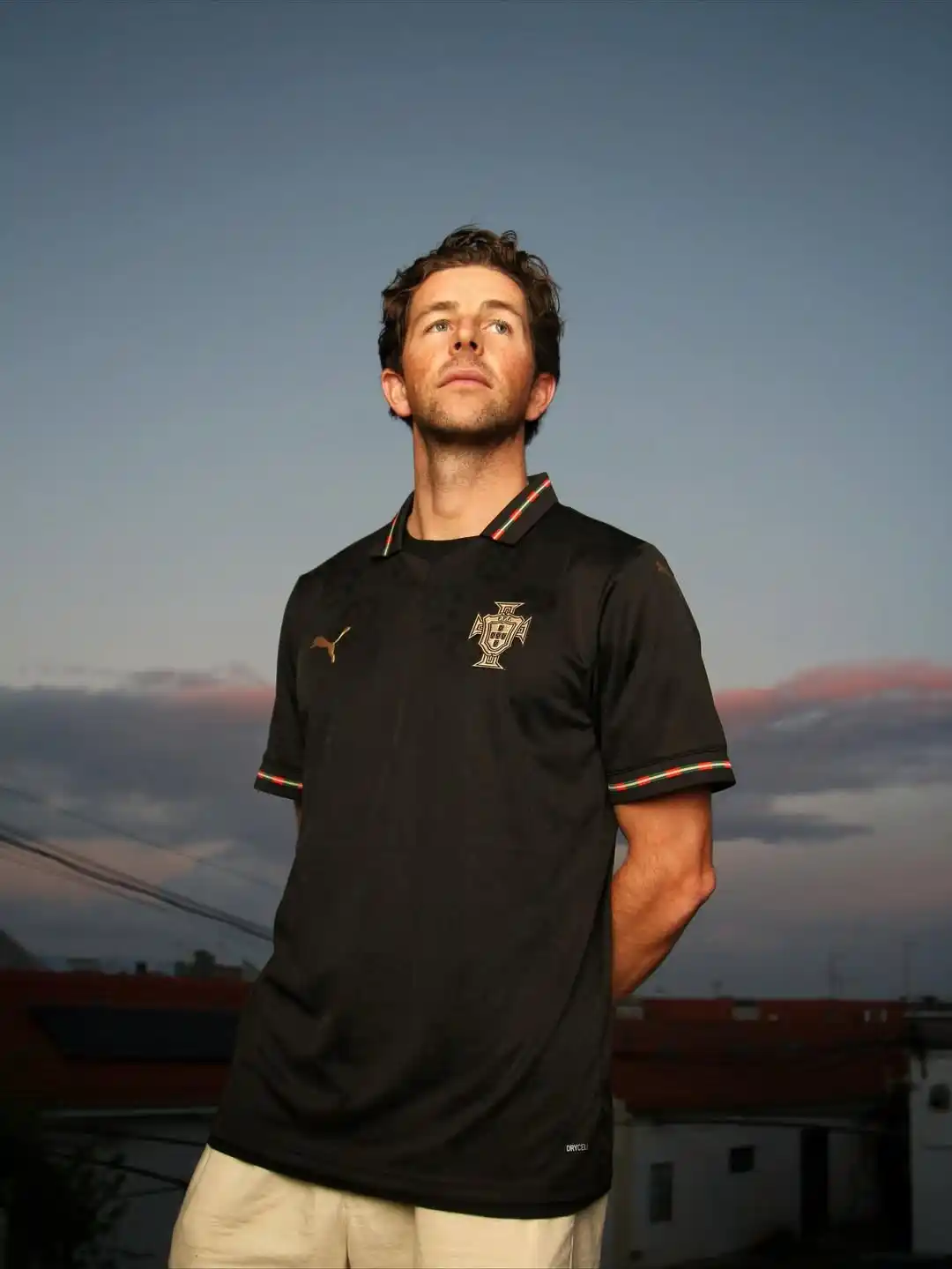 10. Black Portugal Puma Jersey With Cream Chino Shorts At Sunset