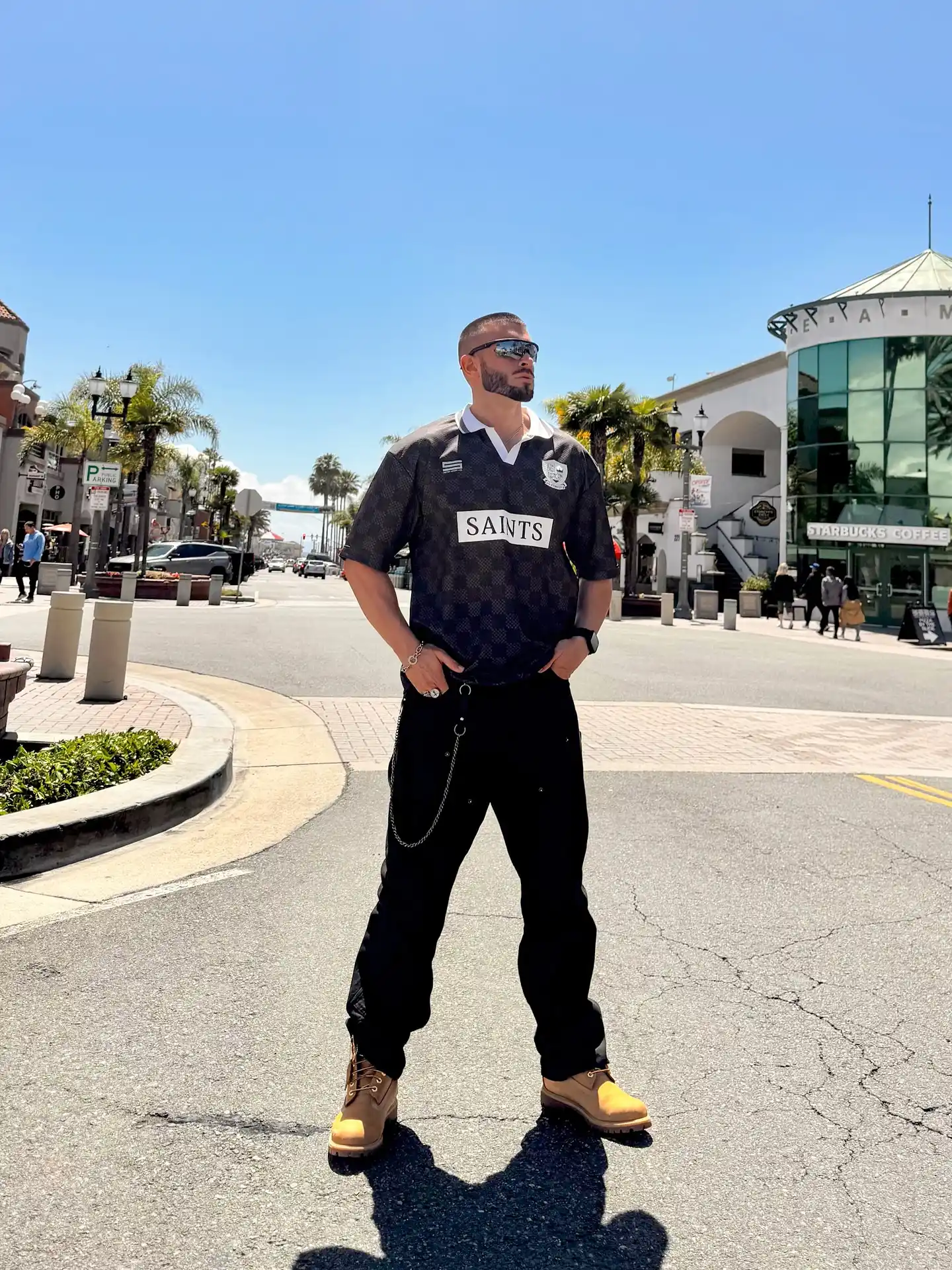 4. Black Saints Soccer Jersey With Black Cargo Pants And Wheat Timberlands