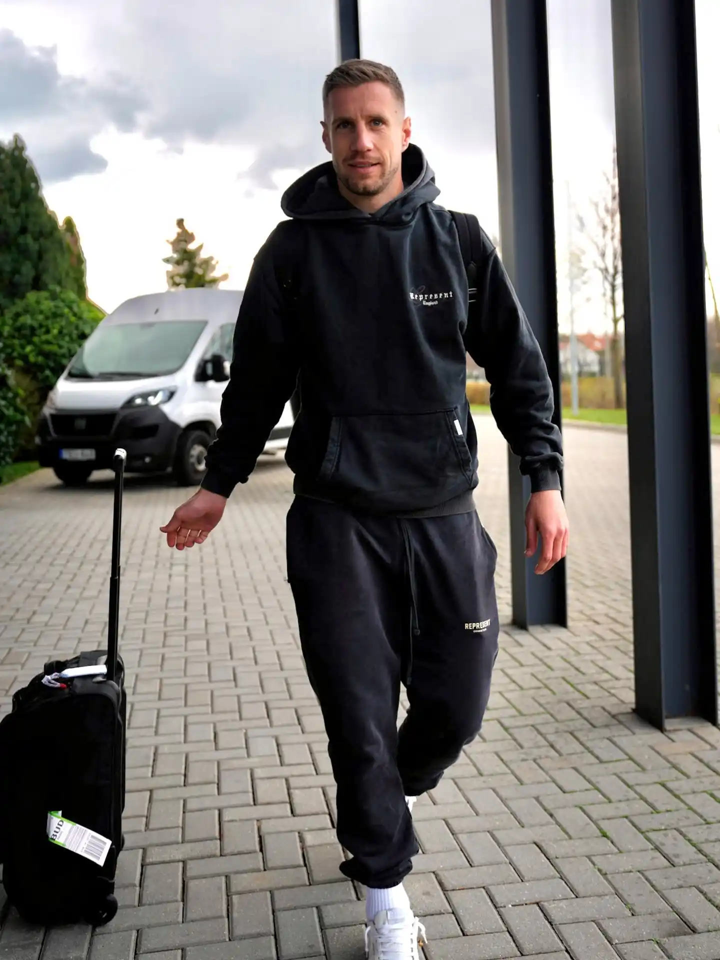 11. The Faded Hoodie and Relaxed Tracksuit Combination