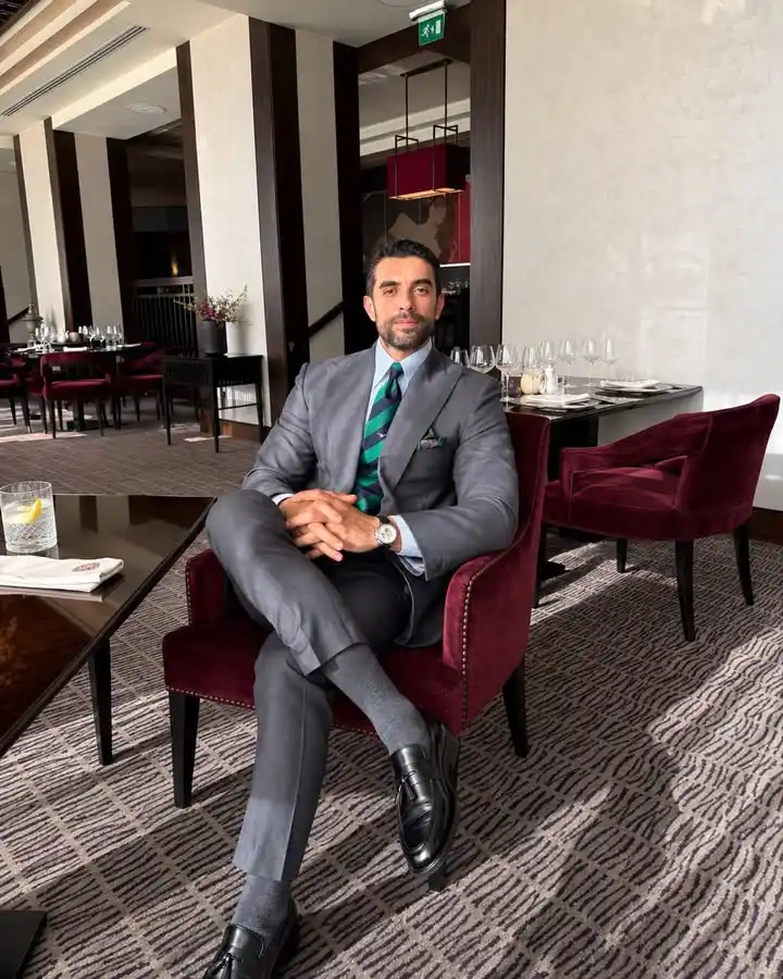 13 Classy Outfits Men Holiday Party Looks for Festive Season 2 1. Classic Grey Suit with Festive Tie